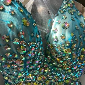 Prom dress teal with sequins, slit up the side. Worn once to prom.